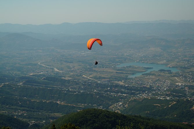 Paragliding Tandem Experience From Dajti Mountain - Landing in a field and returning by taxi