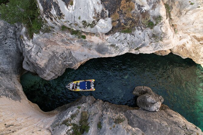 Vlore Private Boat Tour Blue Cave & Grama Bay Adventure - Smuggler’s Canyon squeezes the route between rocks